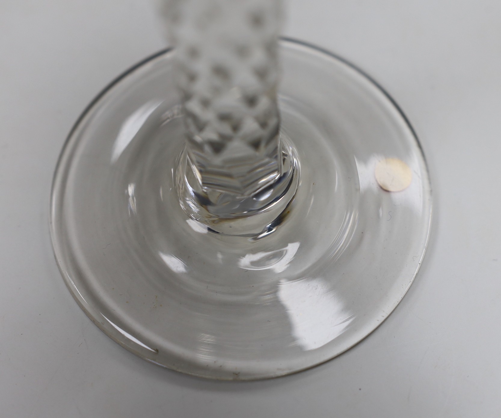 A George III facet stem wine glass, 15cms high